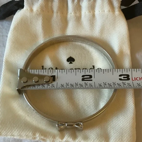Kate Spade: Silver Tone Bow Bracelet- Marks - Picture 12 of 16